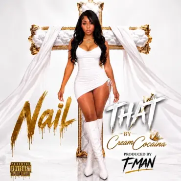 A beautiful afro latina woman stands in front of a gold and silver cross in with long black hair, coke shape body, short white dress, white boots on a white background. The text says Creame Cocaina Nail That produced by T-Man. This is promo for Cream Cocaina new single Nail That.