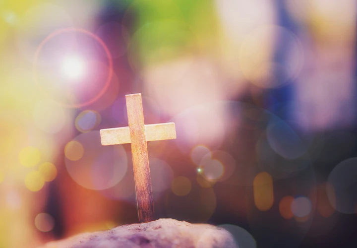 A image on a bokeh background of a Wood cross for Inspir3 Radio Gospel Show.